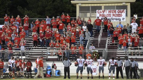 Members of the Pike County High School football team hold Dylan's jersey before the game against Rutland High School on Friday.