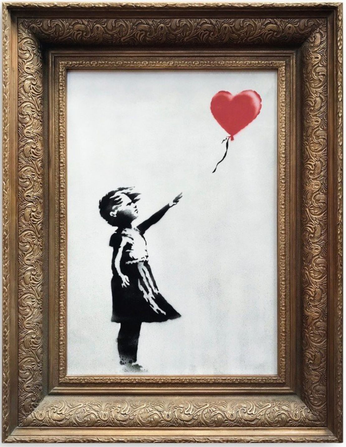 An image of Banksy's Girl with Red Balloon painting that self-destructed just moments after being sold in London.