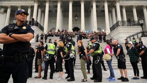 Capitol Police arrest protesters Saturday after they occupied the center steps of the east front of the US Capitol.