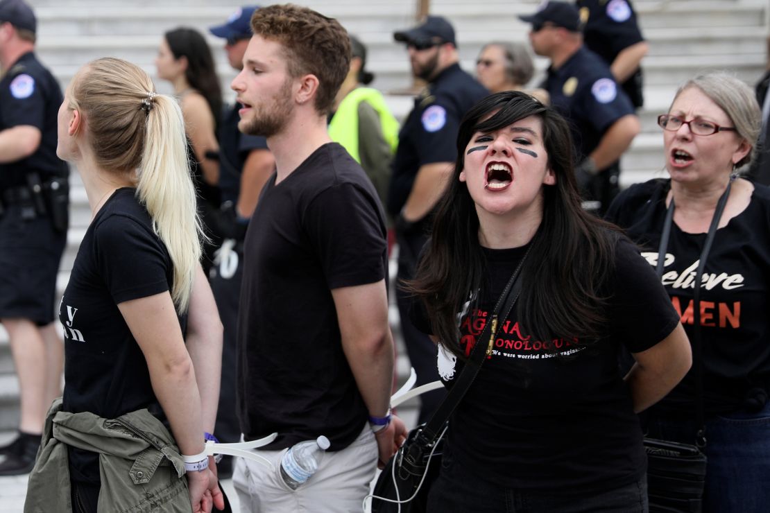 U.S. Capitol Police arrest protesters on the steps of the Capitol before a scheduled vote on the confirmation of Supreme Court nominee Judge Brett Kavanaugh.
