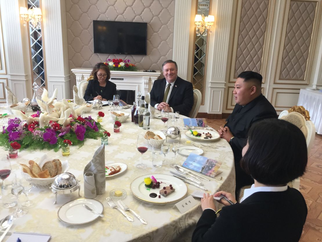 US Secretary of State Mike Pompeo, center, dines with North Korea's Kim Jong Un after their meeting Sunday.