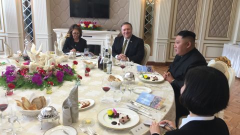 US Secretary of State Mike Pompeo, center, dines with North Korea's Kim Jong Un after their meeting Sunday.