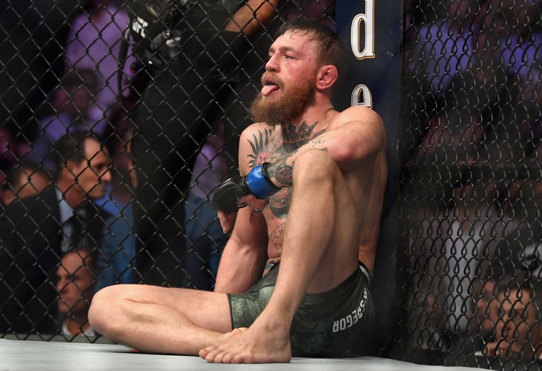 McGregor sits on the mat in the octagon after being defeated by Khabib Nurmagomedov.