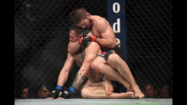 Khabib Nurmagomedov of Russia performs a rear-naked choke on Conor McGregor of Ireland in their UFC lightweight championship bout during the UFC 229 event inside T-Mobile Arena on October 6, 2018. Nurmagomedov defeated McGregor by submission in the fourth round.