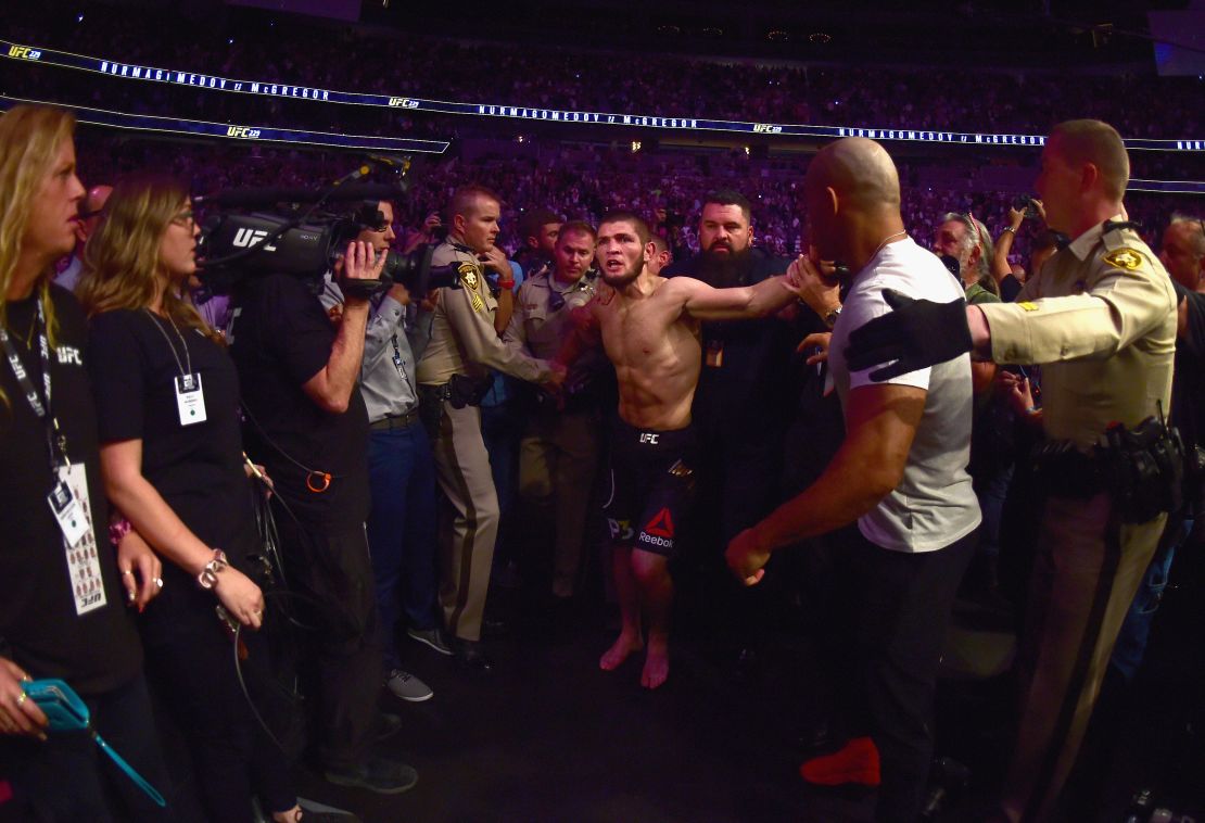  Khabib Nurmagomedov of Russia is escorted out of the arena after defeating Conor McGregor.