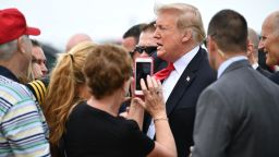 US President Donald Trump greets people upon arrival at Orlando International Airport in Orlando, Florida on October 8, 2018. (Photo by MANDEL NGAN / AFP)        (Photo credit should read MANDEL NGAN/AFP/Getty Images)