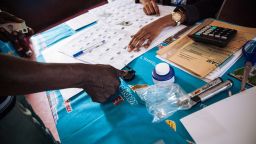 A voter signs the register after voting in the polling station where the incumbent President is expected to vote in Bastos neighbourhood in the capital Yaounde, on October 7, 2018 during Cameroon's presidential election. - Cameroonians began voting in crunch presidential polls, with octogenarian leader seeking a seventh term against a backdrop of unprecedented violence in the country's English-speaking regions. (Photo by ALEXIS HUGUET / AFP)        (Photo credit should read ALEXIS HUGUET/AFP/Getty Images)