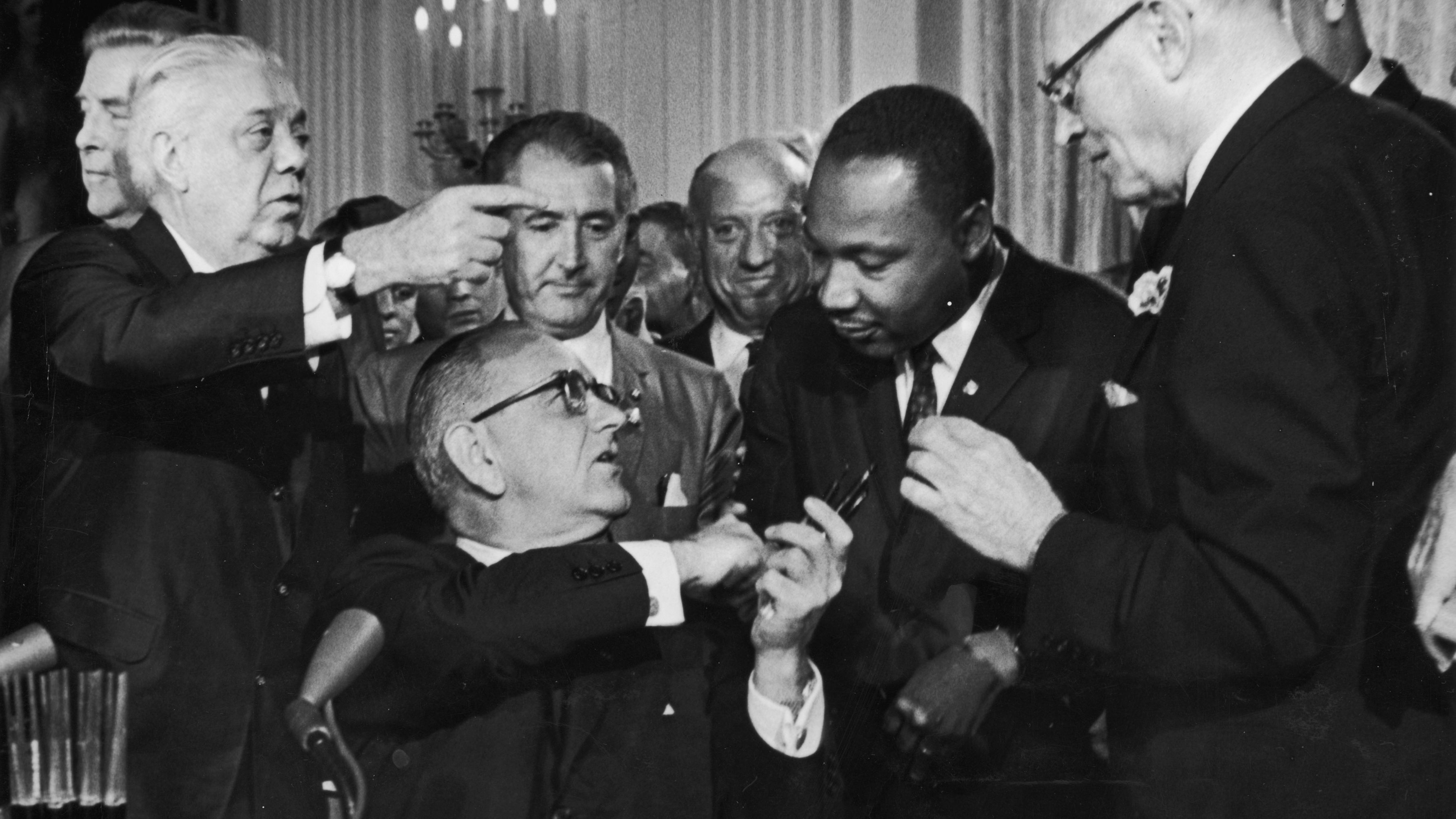  President Lyndon Johnson greets the Rev. Martin Luther King Jr. at the signing of the 1964 Civil Rights Act. 