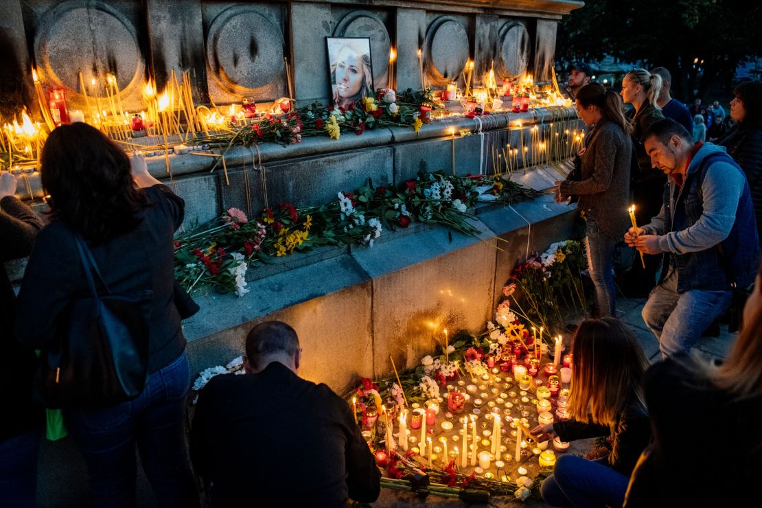 Bulgarians light candles during a vigil in memory of Viktoria Marinova in the city of Ruse on Monday.
