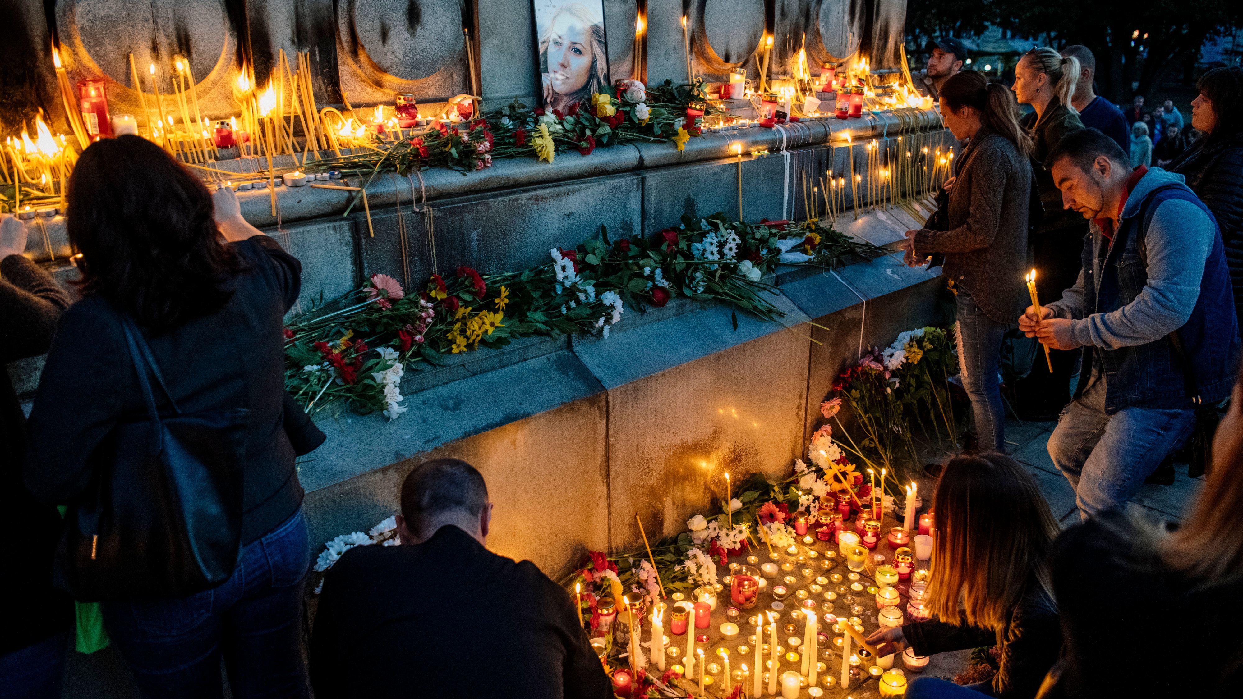 Bulgarians light candles during a vigil in memory of Viktoria Marinova in the city of Ruse on Monday.