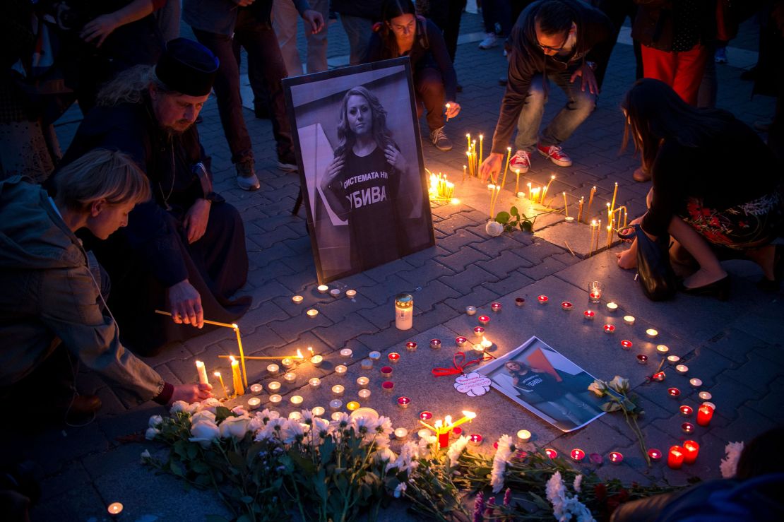 People light candles during a vigil in memory of Viktoria Marinova in the Bulgarian capital, Sofia, on Monday.