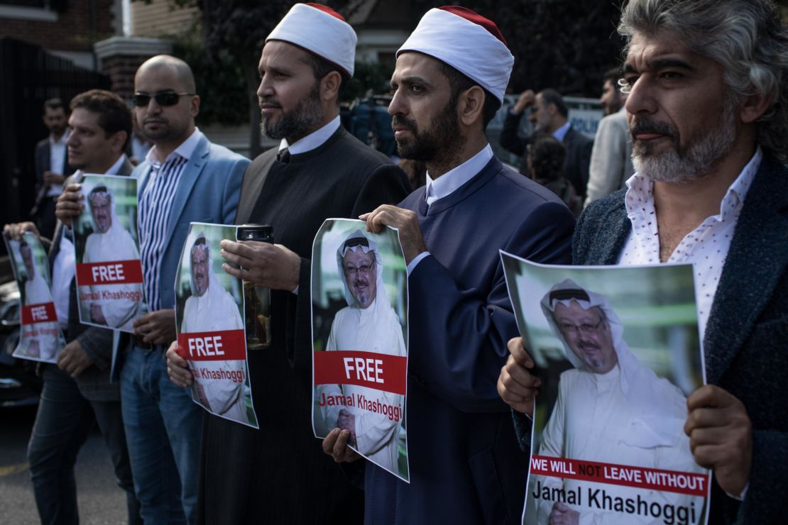 People hold posters of Saudi journalist Jamal Khashoggi during a protest organized by members of the Turkish-Arabic Media Association at the entrance to the Saudi Arabia Consulate on October 5, 2018 in Istanbul.