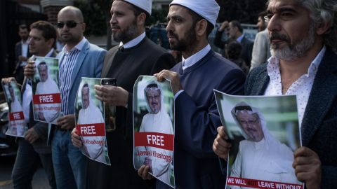 People hold posters of Saudi journalist Jamal Khashoggi during a protest organized by members of the Turkish-Arabic Media Association at the entrance to the Saudi Arabia Consulate on October 5, 2018 in Istanbul.