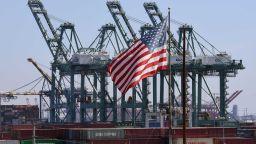 The US flag flies over Chinese shipping containers that were unloaded at the Port of Long Beach, in Los Angeles County, on September 29, 2018. - President Donald Trump insisted that there had been "absolutely no impact" on the US economy from the escalating trade dispute between his administration and China. "We have to make it fair. So we're at $250 billion now, 25 percent interest," he said in reference to a package of tariffs imposed on Chinese imports. (Photo by Mark RALSTON / AFP)        (Photo credit should read MARK RALSTON/AFP/Getty Images)