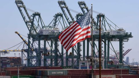 Shipping containers from China are unloaded at the Port of Long Beach. The US trade deficit edged up in March as American companies imported more than they exported, figures show.