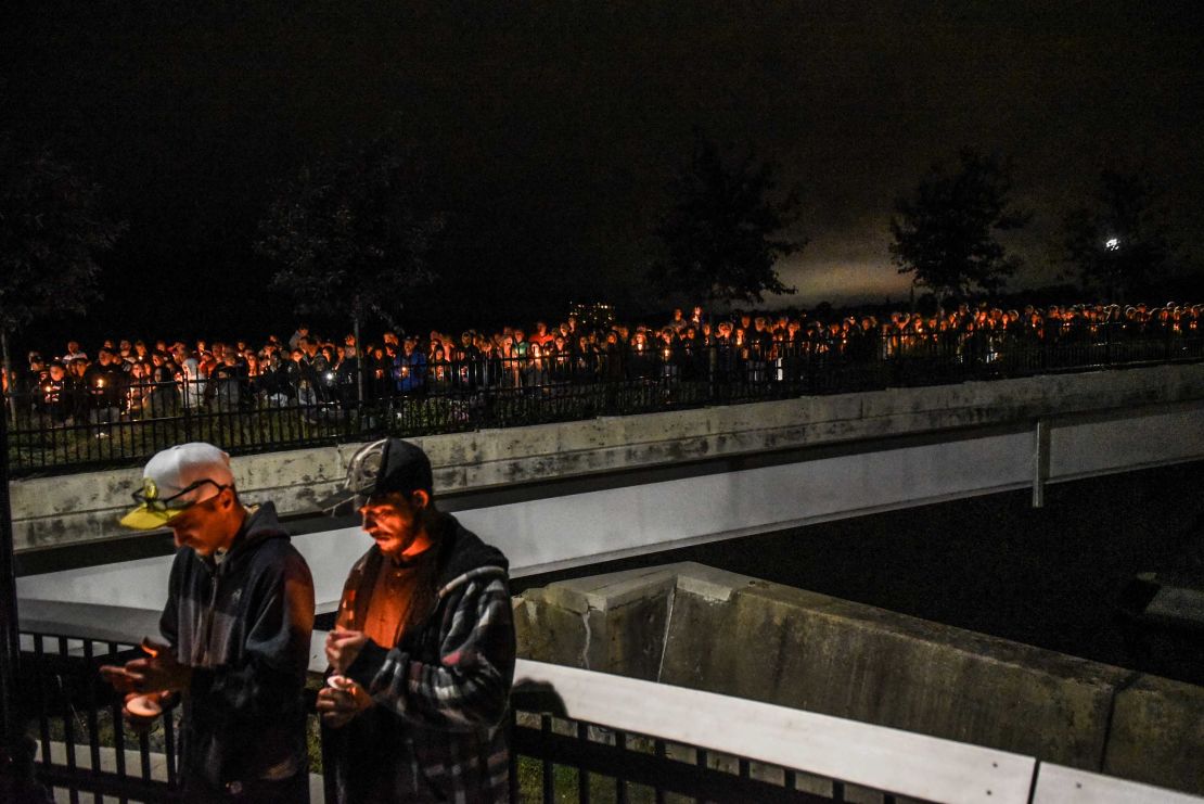 Mourners in Amsterdam, New York, attend a candlelight vigil for the victims of the fatal limousine crash.