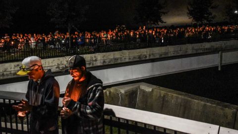 Mourners attend a Monday night candlelight vigil for victims of the fatal limousine crash.