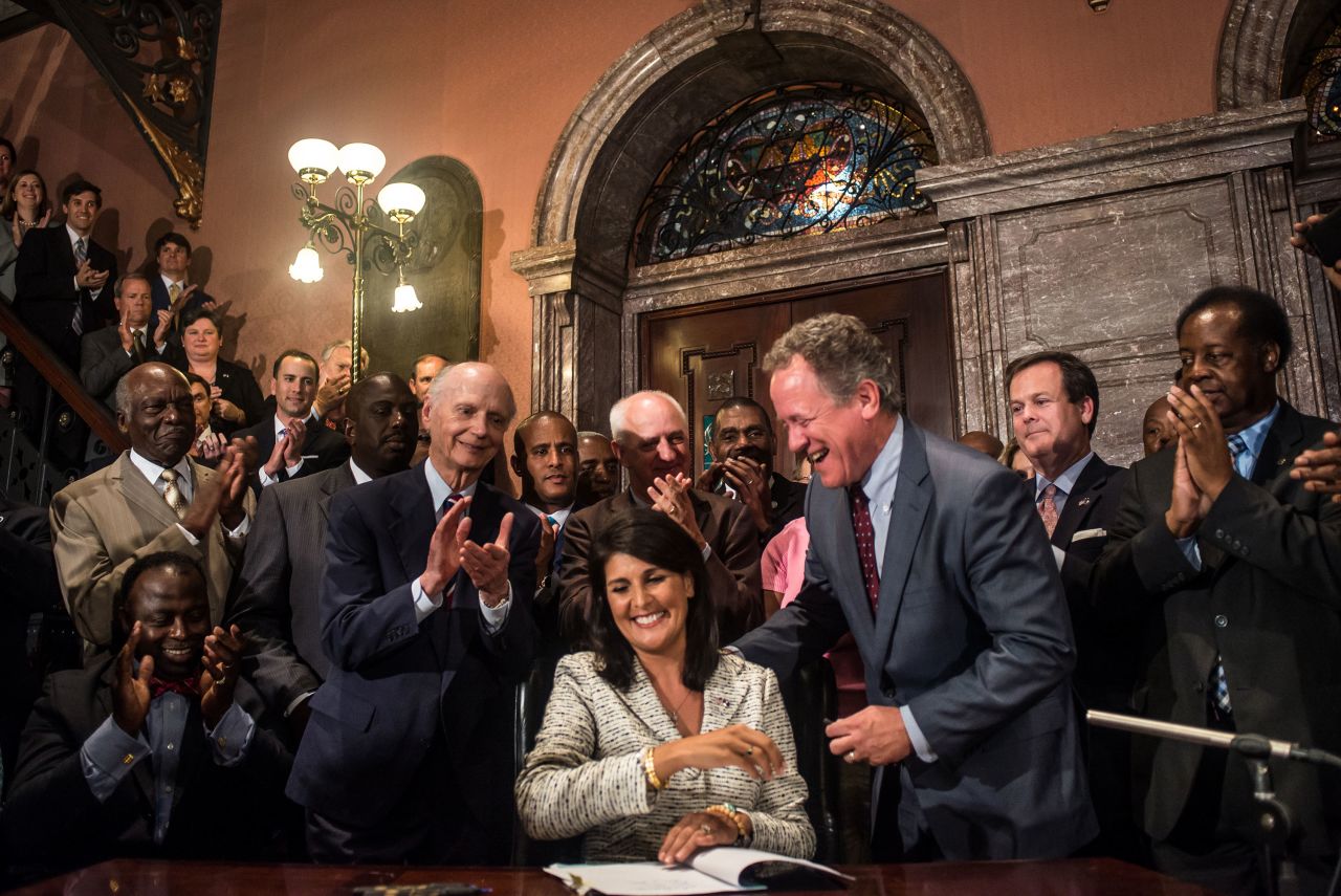 Haley signs a bill to remove the Confederate battle flag from the State House grounds.