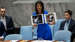 NEW YORK, NY - APRIL 5: U.S. Ambassador to the United Nations Nikki Haley holds up photos of victims of the Syrian chemical attack during a meeting of the United Nations Security Council at U.N. headquarters, April 5, 2017 in New York City. The Security Council is holding emergency talks on Wednesday following the worst use of chemical weapons in Syria since the Ghouta attack in 2013. (Photo by Drew Angerer/Getty Images)