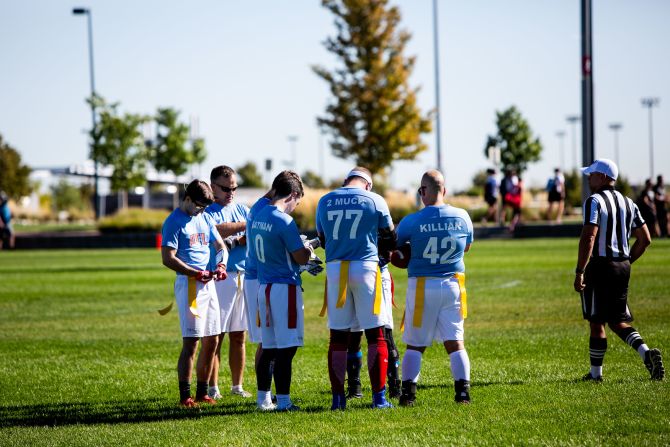 Atlanta players check their plays drawn on wristbands during the huddle.