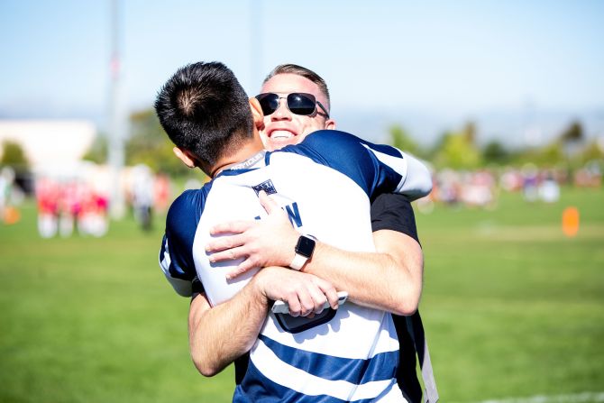 Though competition on the field is fierce, teammates and opponents often embrace afterward.