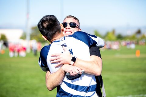 Though competition on the field is fierce, teammates and opponents often embrace afterward. 