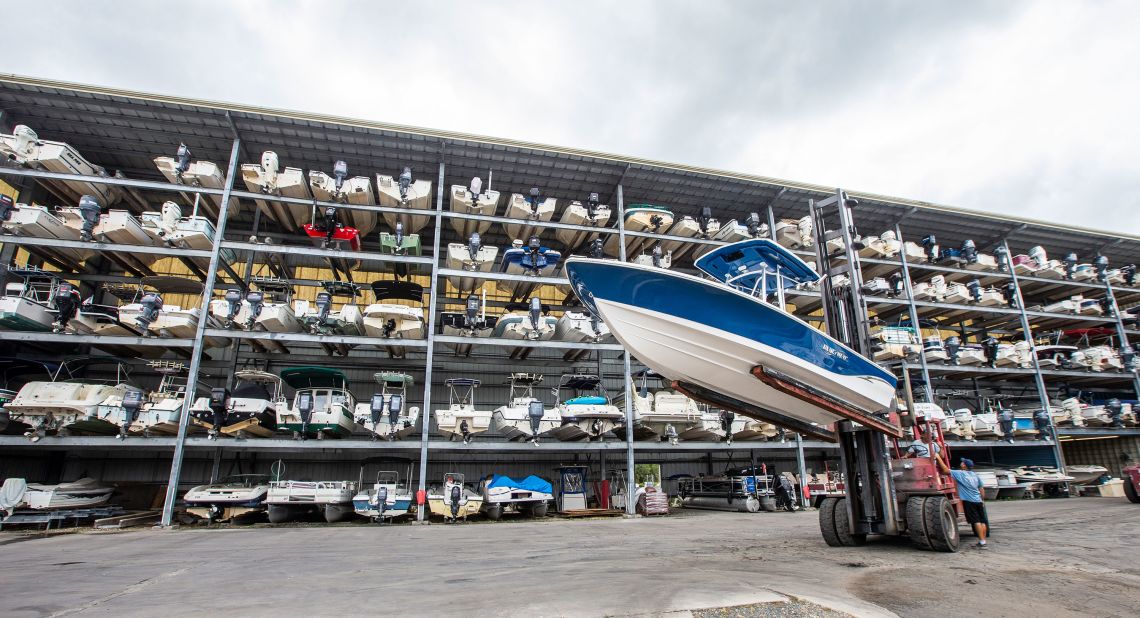 Workers scramble to store boats at Shields Marina in St. Marks.