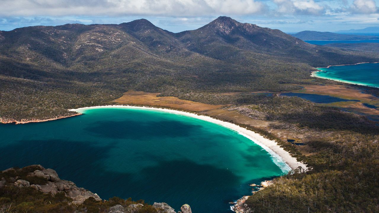 <strong>Wineglass Bay: </strong>In the middle of Freycinet National Park, Wineglass Bay's postcard-perfect harbor is where pink granite peaks meet a clamshell-shaped beach of powdery sand, fading into a sapphire sea that is eye-poppingly pretty.