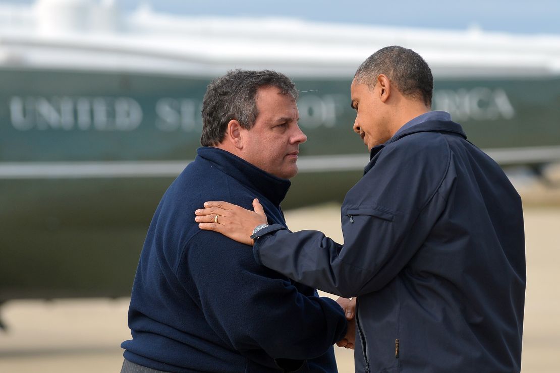 President Barack Obama is greeted by New Jersey Governor Chris Christie upon arriving in Atlantic City, New Jersey, on Oct. 31, 2012, to visit areas hardest hit by Sandy.