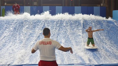 A boy rides the Flowrider, a surfing simulator at Kalahari's water park in Wisconsin Dells, Wisconsin. 