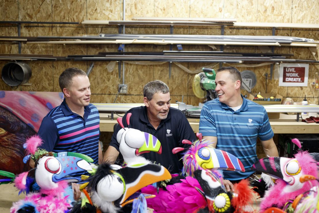 Nelson (center), with his sons Travis (left) and Todd (right).