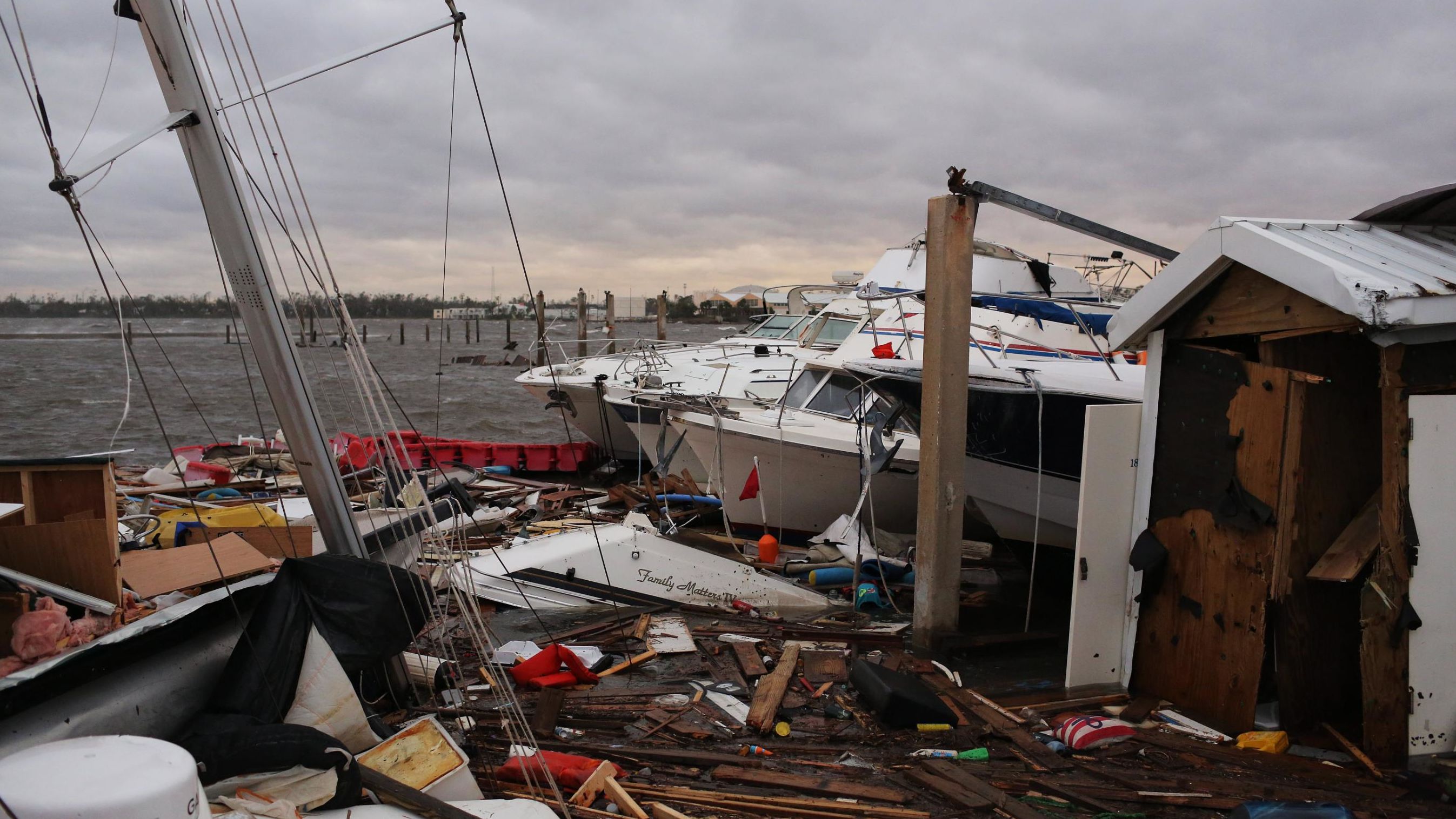 Wrecked boats sit near a pier in Panama City.