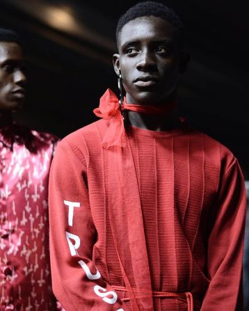 Orange Culture backstage at Lagos Fashion Week 2017. On its runway male models wear dresses and make up within a conservative Nigerian society.