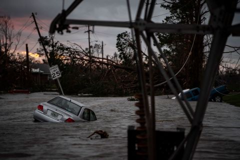 Floodwaters overwhelm vehicles in Panama City on Wednesday, October 10.