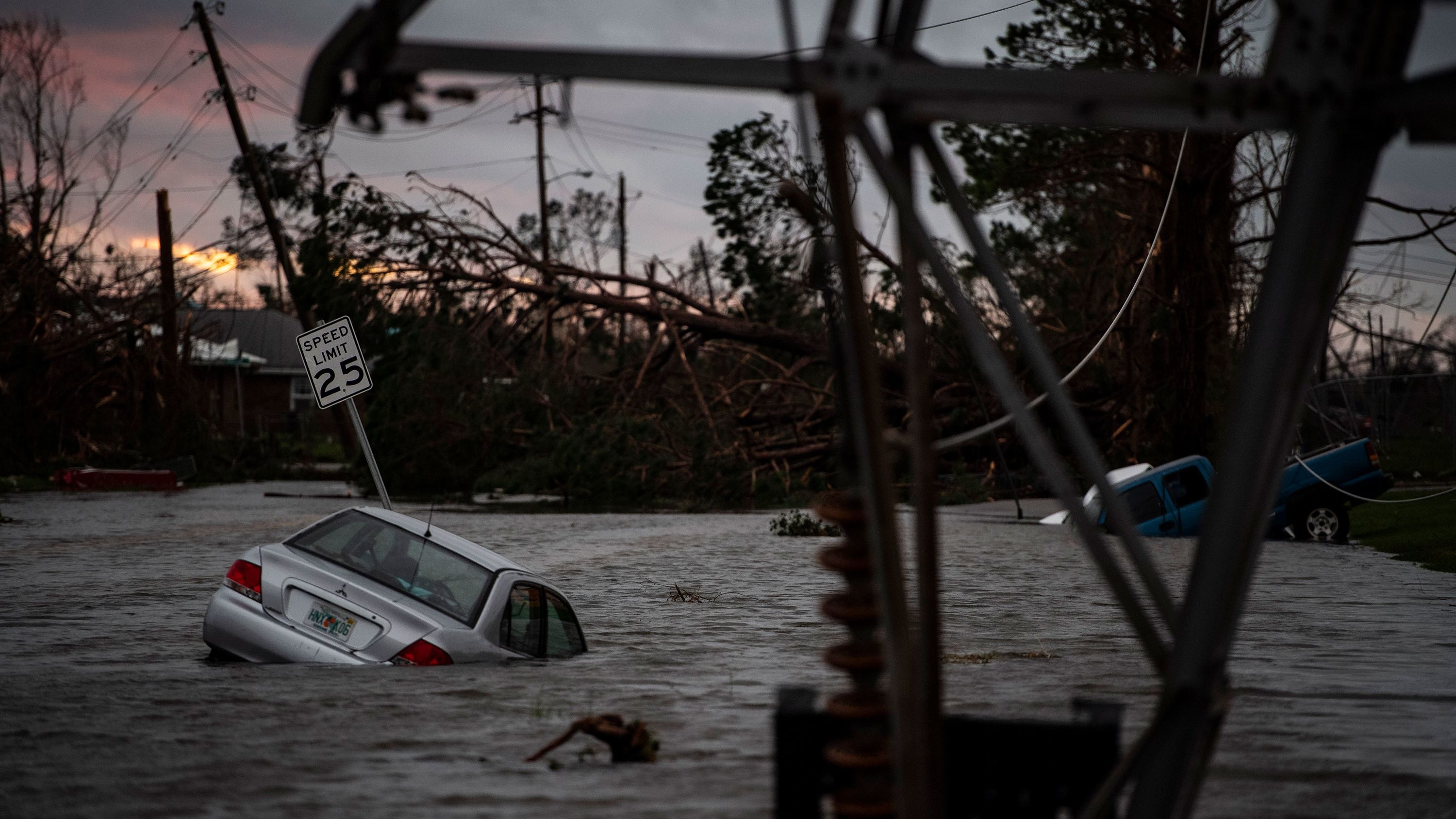 Floodwaters overwhelm vehicles in Panama City on Wednesday, October 10.