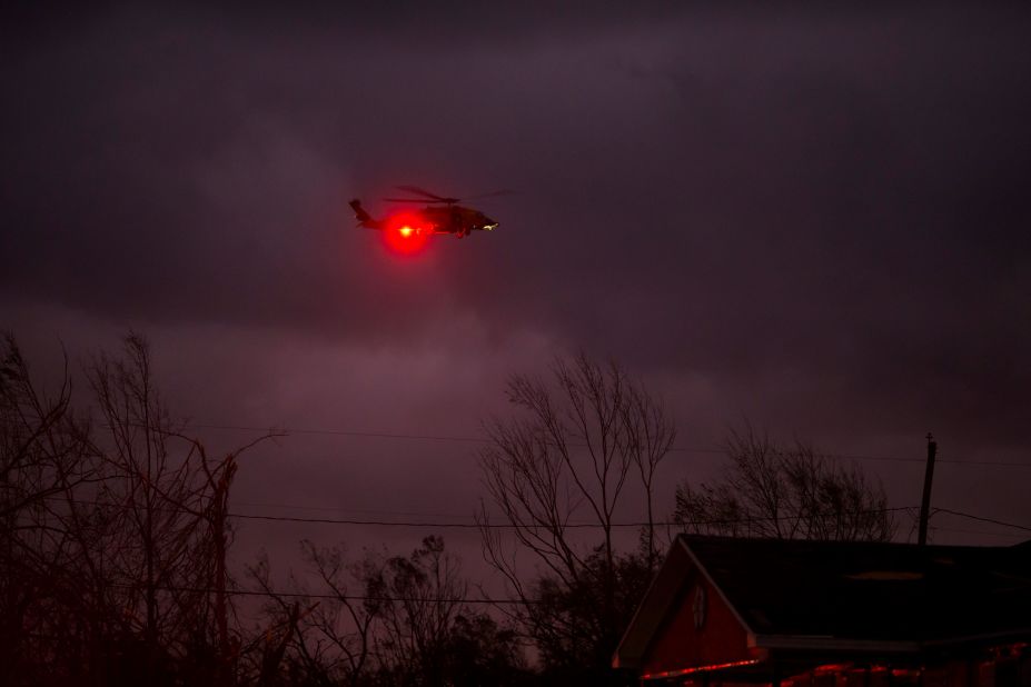 A helicopter circles a Panama City neighborhood in the storm's wake on October 10.