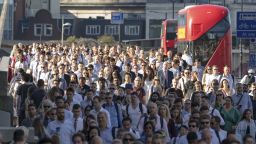 Crowds of commuters walk to work across London Bridge in London, England on August 03, 2018 during hot sunny weather as the heatwave continues in the capital and across Europe.  (photo by Vickie Flores/In Pictures via Getty Images)