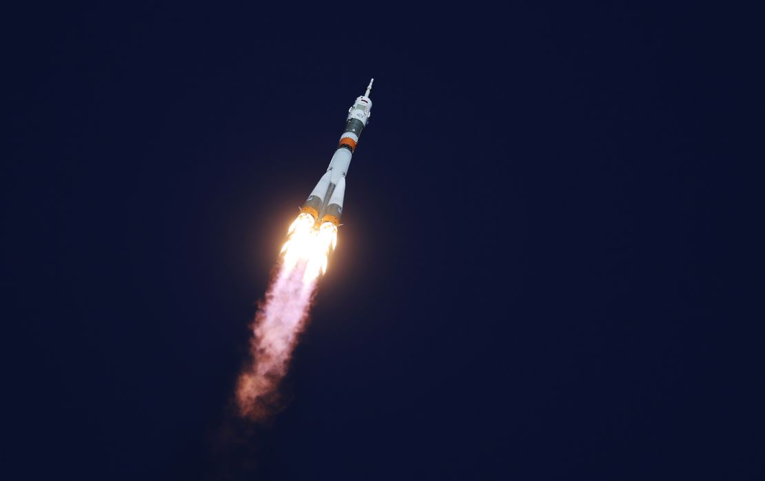 The Soyuz-FG rocket booster blasts off from the Baikonur Cosmodrome carrying the Soyuz MS-10 spacecraft and crew.