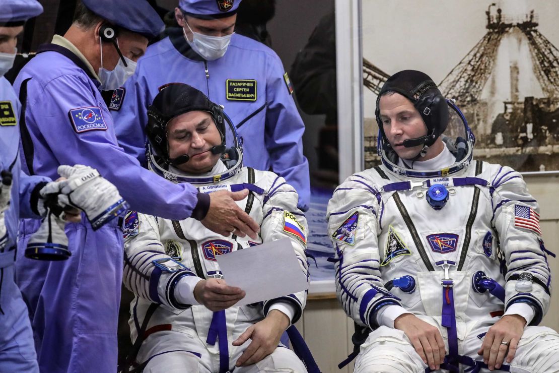 Ovchinin, left, and Hague, right, ahead of the Soyuz space flight on October 11. 