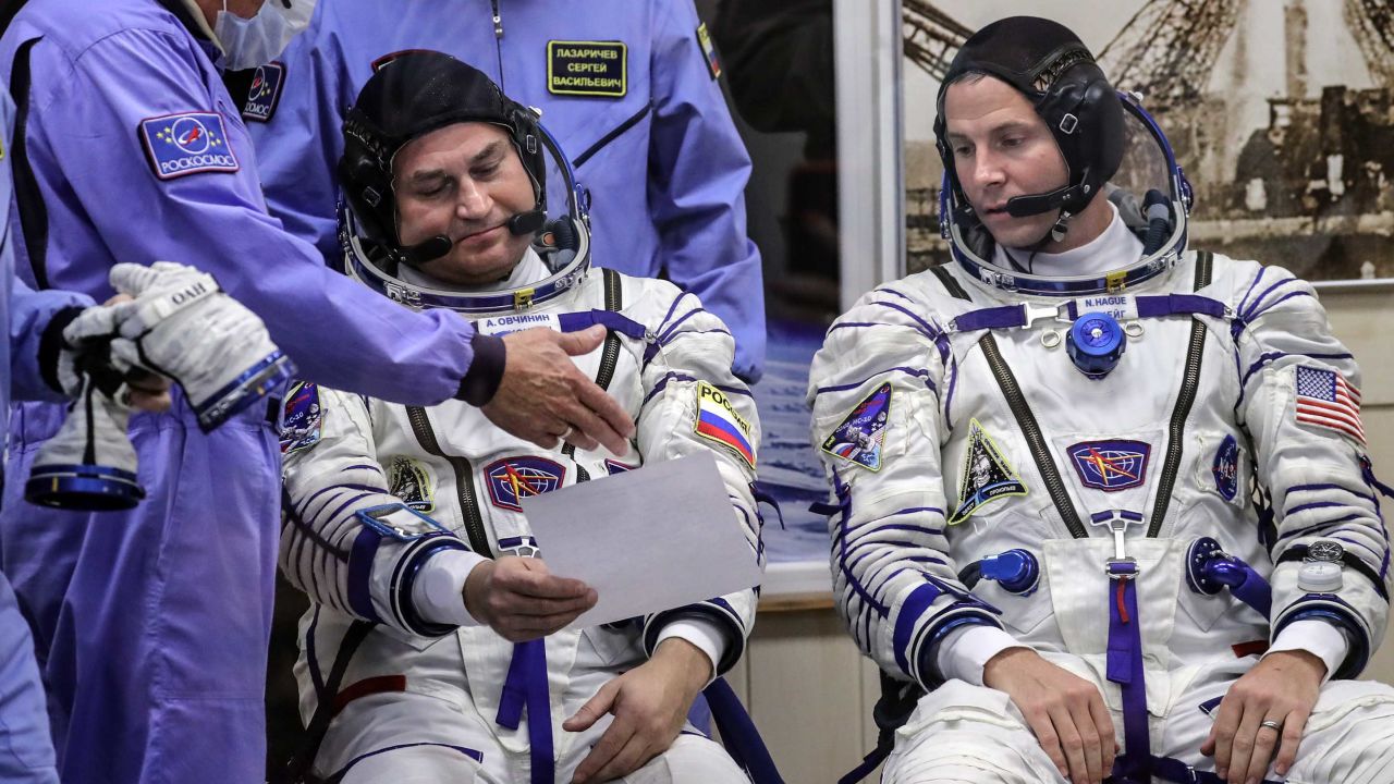 Ovchinin, left, and Hague, right, ahead of the Soyuz space flight on October 11. 