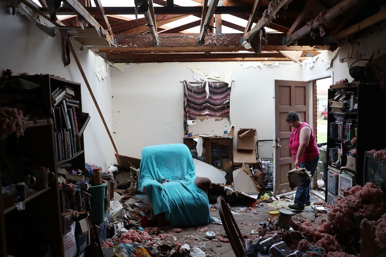 Amanda Logsdon faces a heavy cleanup task at her Panama City house on October 11.