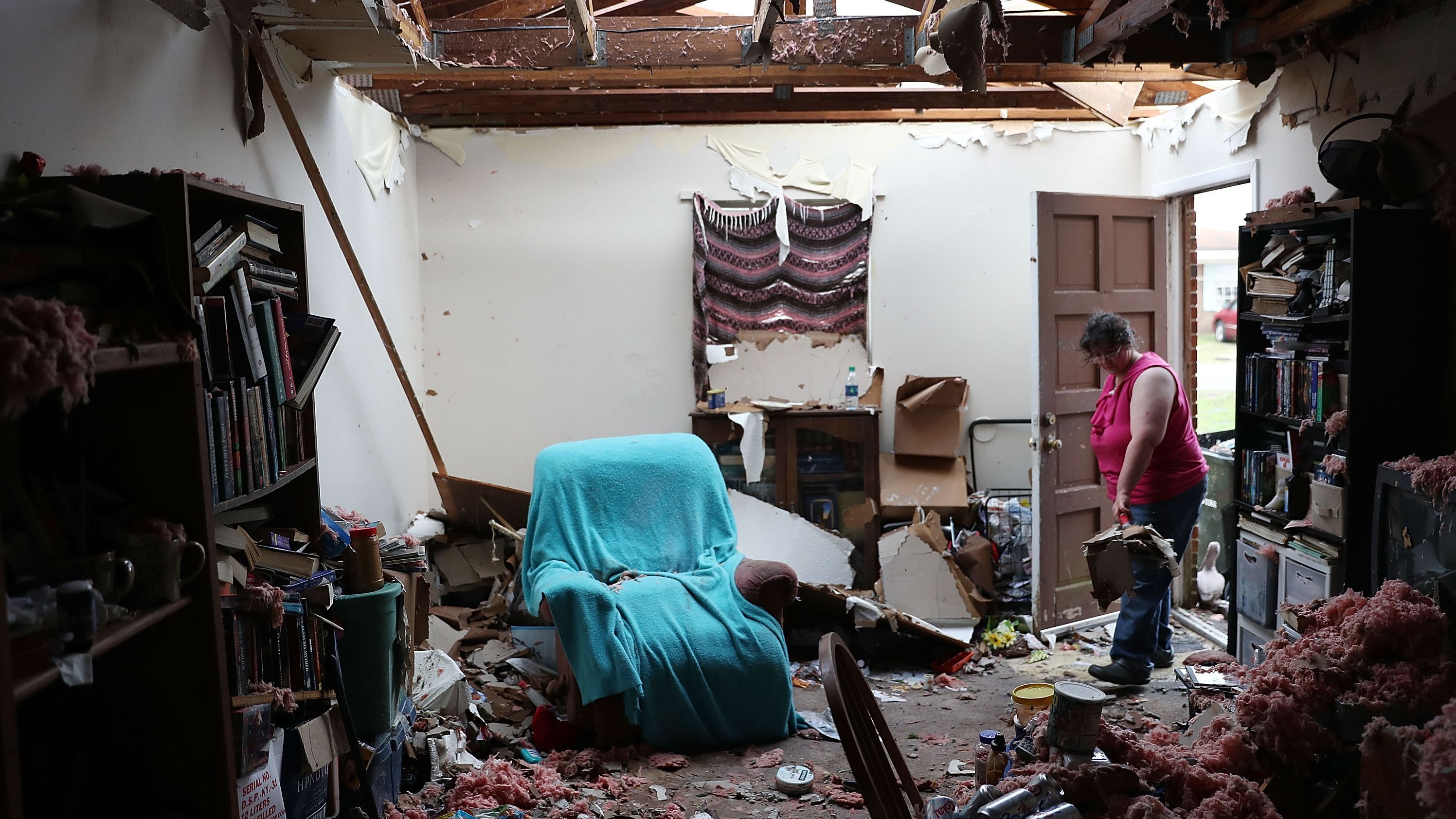 Amanda Logsdon faces a heavy cleanup task at her Panama City house on October 11.