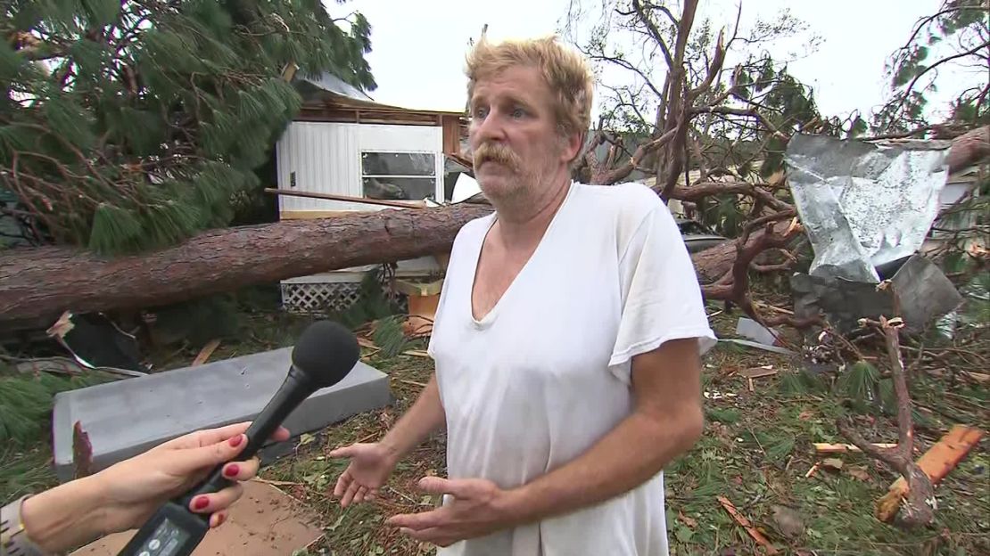 Frank Knight, outside the wreckage of his home: "I've got to ... salvage what I can." 