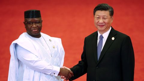 Sierra Leone's President Julius Maada Bio (L) shakes hands with China's President Xi Jinping during the Forum on China-Africa Cooperation at the Great Hall of the People in Beijing on September 3, 2018.  