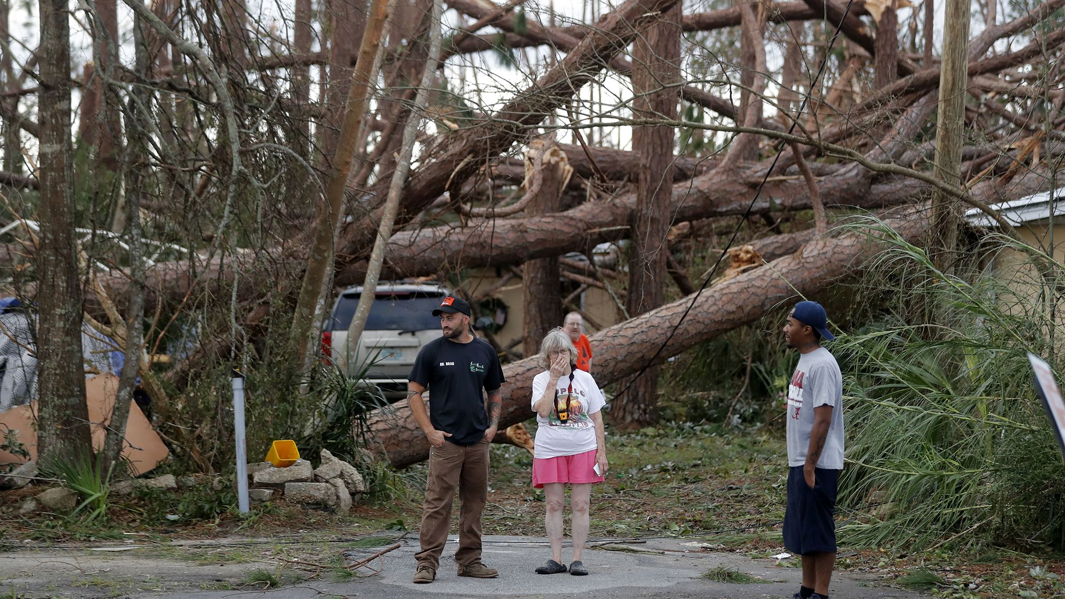 Joyce Fox stands in front of her heavily damaged home in Panama City on October 11.
