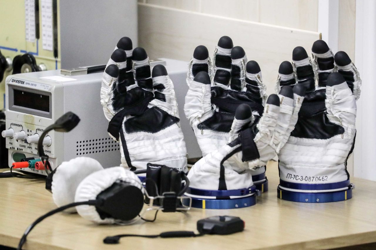 Gloves from the astronauts' space suits are checked ahead of the scheduled launch on October 11.