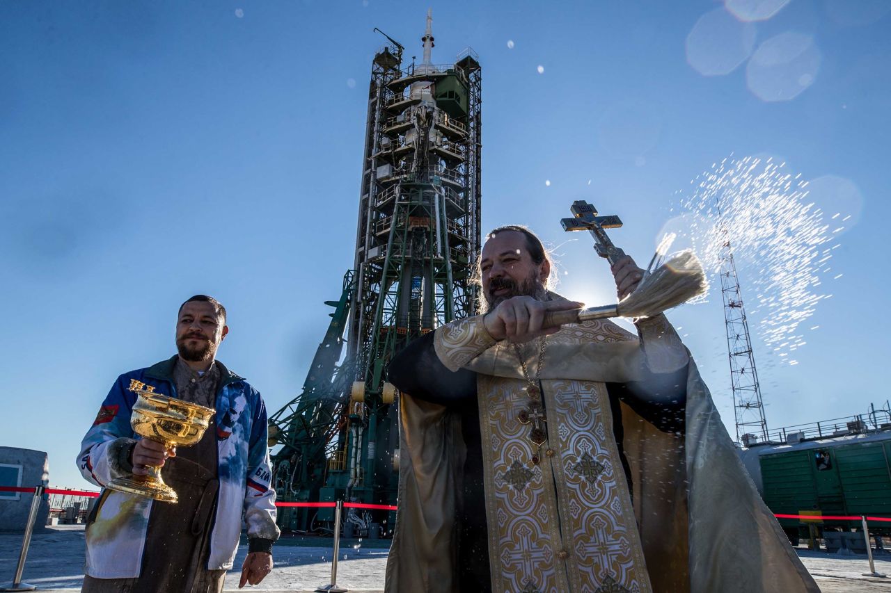 An Orthodox priest blesses the Soyuz-FG rocket booster launch site on Wednesday, October 10.