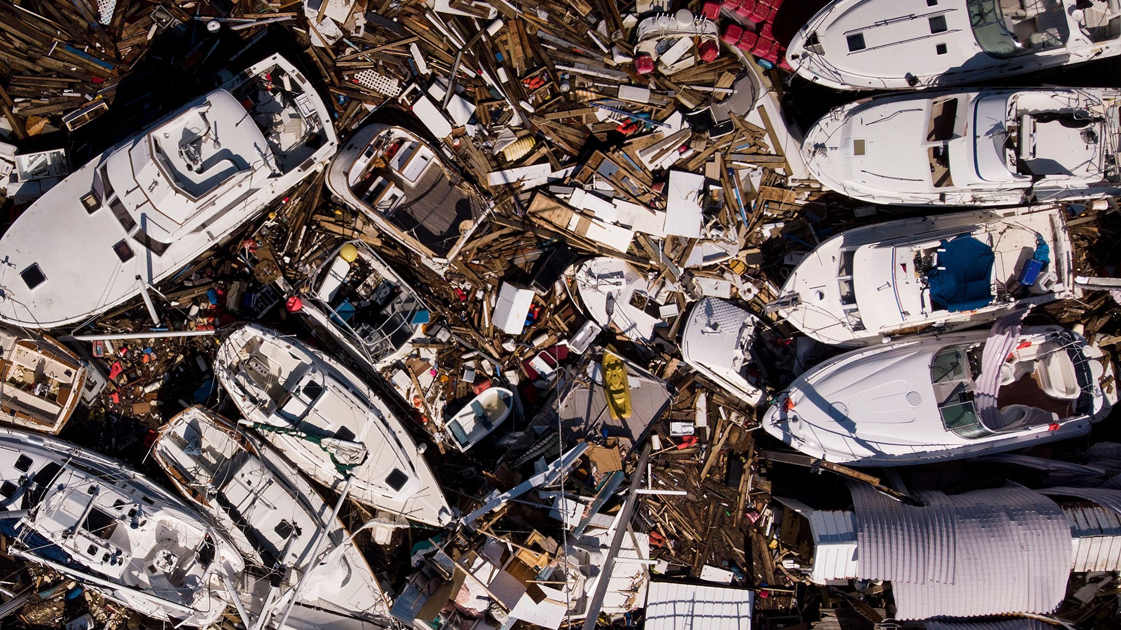 Storm-damaged boats are piled up in Panama City on October 11.