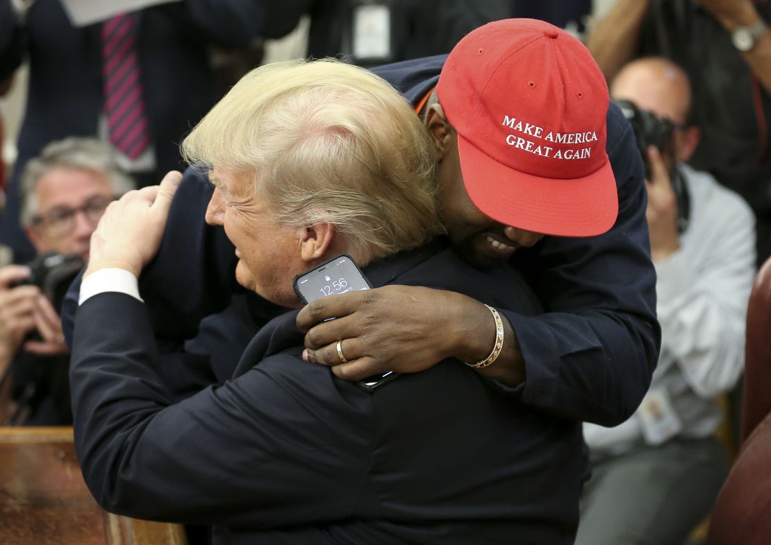 President Donald Trump hugs rapper Kanye West during a meeting in the Oval office of the White House on October 11, 2018 in Washington, DC.