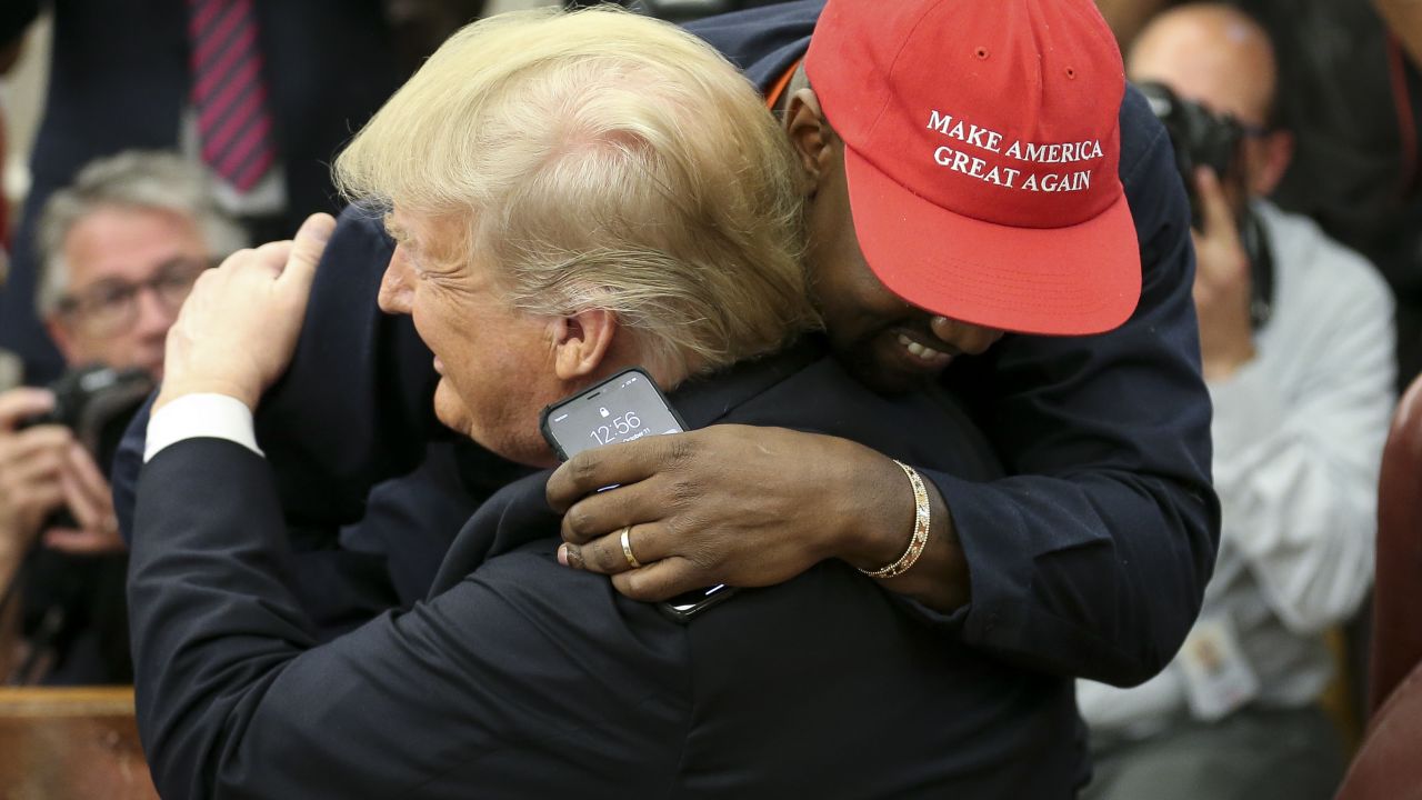 President Donald Trump hugs rapper Kanye West during a meeting in the Oval office of the White House on October 11, 2018 in Washington, DC.